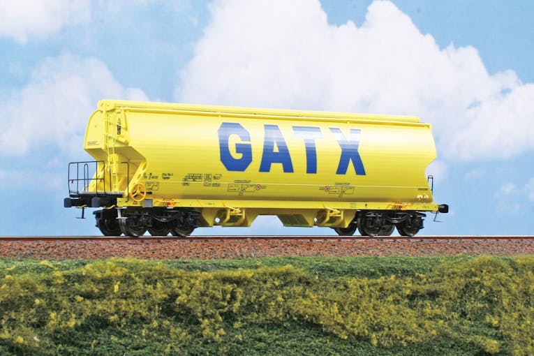 NME 525604 Carro tramoggia per trasporto cereali Tagnpps 95m³,GATX, livrea giallo, ep,VI. H0, DC